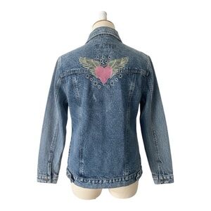 • Classic medium-wash denim jacket with a fitted, slightly tailored silhouette •